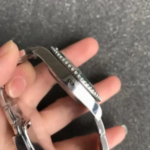 Rolex Submariner 41mm Zifferblatt Schwarz with Gruen Luenette 126610 Taucheruhr - Krone und Luenette